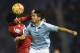 Espanyol's defender Alvaro Gonzalez (L) heads the ball with Celta Vigo's forward Nolito during the Spanish league football match Celta Vigo vs Real CD Espanyol at the Balaidos stadium in Vigo on December 12, 2015. AFP PHOTO / MIGUEL RIOPA / AFP / MIGUEL RIOPA (Photo credit should read MIGUEL RIOPA/AFP/Getty Images)