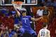 MIAMI, FL - NOVEMBER 27: Skal Labissiere of the Kentucky Wildcats hangs on the basket after being fouled on the way up by the South Florida Bulls on November 27, 2015 at the American Airlines Arena in Miami, Florida. Kentucky defeated South Florida 84-63. (Photo by Joel Auerbach/Getty Images)