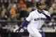 Seattle Mariners' Ken Griffey Jr. hits a solo home run on a pitch from Texas Rangers' Tommy Hunter during the fourth inning of a baseball game in Seattle on Saturday, Oct. 3, 2009. (AP Photo/John Froschauer)