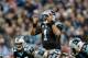 CHARLOTTE, NC - JANUARY 03: Cam Newton #1 of the Carolina Panthers makes a call at the line against the Tampa Bay Buccaneers in the 4th quarter during their game at Bank of America Stadium on January 3, 2016 in Charlotte, North Carolina. (Photo by Streeter Lecka/Getty Images)