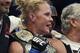 Holly Holm holds the champion belt after defeating Ronda Rousey during their UFC 193 bantamweight title fight in Melbourne, Australia, Sunday, Nov. 15, 2015. Holm pulled off a stunning upset victory over Rousey in the fight, knocking out the women's bantamweight champion in the second round with a powerful kick to the head Sunday. (AP Photo/Andy Brownbill)
