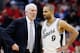 HOUSTON, TX - DECEMBER 25: Head coach Gregg Popovich of the San Antonio Spurs chats with Tony Parker #9 during their game against the Houston Rockets at the Toyota Center on December 25, 2015 in Houston, Texas. NOTE TO USER: User expressly acknowledges and agrees that, by downloading and or using this Photograph, user is consenting to the terms and conditions of the Getty Images License Agreement. (Photo by Scott Halleran/Getty Images)