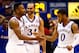 LAWRENCE, KS - JANUARY 04: Wayne Selden Jr. #1 of the Kansas Jayhawks is congratulated by Perry Ellis #34 and Frank Mason III #0 after making a three-pointer and drawing a foul during the second overtime of the game against the Oklahoma Sooners game at Allen Fieldhouse on January 4, 2016 in Lawrence, Kansas. The Jayhawks defeated the Sooners in triple overtime with a final score of 109-106 to win the game. (Photo by Jamie Squire/Getty Images)