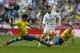 Real Madrid's Francisco Roman “Isco”, right, vies for the ball with Las Palmas' Vicente Gomez during the Spanish La Liga soccer match between Real Madrid and Las Palmas at the Santiago Bernabeu stadium in Madrid, Saturday, Oct. 31, 2015. Isco scored once in Real Madrid's 3-1 victory. (AP Photo/Francisco Seco)