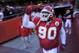 Kansas City Chiefs defensive tackle Shaun Smith (90) points to the sky as he runs onto the field for their start of their NFL football game against the Oakland Raiders in Kansas City, Mo., Sunday, Jan. 2, 2011. (AP Photo/Reed Hoffmann)