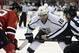 Los Angeles Kings' Mike Richards (10) prepares to take a face-off against New Jersey Devils' Travis Zajac during the first period of an NHL hockey game Monday, March 23, 2015, in Newark, N.J. (AP Photo/Bill Kostroun)
