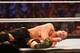 NEW YORK, NY - AUGUST 23: John Cena recovers from a blow during his fight against Seth Rollins at the WWE SummerSlam 2015 at Barclays Center of Brooklyn on August 23, 2015 in New York City. (Photo by JP Yim/Getty Images)