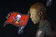Tampa Bay Buccaneers head coach Lovie Smith walks off the stage after his end of the season news conference Monday, Jan. 4, 2016, in Tampa, Fla. The Buccaneers finished with a 6-10 record. (AP Photo/Chris O'Meara)