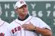 Former Boston Red Sox pitcher Roger Clemens pats his chest to cheering fans during a ceremony prior to a baseball game between the Red Sox and the Seattle Mariners at Fenway Park in Boston on Tuesday, July 30, 2013. The Red Sox are celebrating the 25th anniversary of a streak in 1988 that began after Joe Morgan became manager of the team. (AP Photo/Elise Amendola)