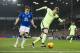 Everton's Seamus Coleman, left, fights for the ball against Manchester City's Kevin De Bruyne during the English League Cup semi final first leg soccer match between Everton and Manchester City at Goodison Park Stadium, Liverpool, England, Wednesday Jan. 6, 2016. (AP Photo/Jon Super)