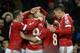 Martial's team-mates congratulate him on his goal against Swansea.