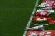 Flowers lie on the side of the pitch during a memorial service at Anfield in Liverpool, north west Engand on April 15, 2015, on the 26th anniversary of the Hillsborough Disaster, where 96 Liverpool supporters died at the 1989 FA Cup semi final between Liverpool and Nottingham Forest at Hillsborough football ground in Sheffield. AFP PHOTO / PAUL ELLIS (Photo credit should read PAUL ELLIS/AFP/Getty Images)