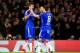Chelsea's Diego Costa, left, and Oscar celebrate after Porto scored an own goal to open the score during the Champions League group G soccer match between Chelsea and FC Porto at Stamford Bridge stadium in London, Wednesday, Dec. 9, 2015.(AP Photo/Alastair Grant)