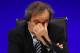 FILE - In this May 24, 2013 file photo UEFA President Michel Platini reacts as he speaks to members of the media at the end of the 37th Ordinary UEFA Congress in London. (AP Photo/Sang Tan, file)