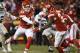 Kansas City Chiefs quarterback Alex Smith (11) hands off to Kansas City Chiefs running back Kansas City Chiefs running back Spencer Ware (32) during the second half of their NFL football game against the Oakland Raiders in Kansas City, Mo., Sunday, Jan, 3, 2016. (AP Photo/Reed Hoffmann)