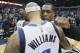 Dallas Mavericks guard Deron Williams gets a hug from Sacramento Kings guard Rajon Rondo after an NBA basketball game Tuesday, Jan. 5, 2016, in Dallas. The Mavericks won 117-116 in double overtime. (AP Photo/LM Otero)
