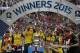 The Arsenal team including Arsenal's German defender Per Mertesacker (3L) and Arsenal's German midfielder Mesut Ozil (C) pose with the trophy after winning the FA Cup final football match between Aston Villa and Arsenal at Wembley stadium in London on May 30, 2015. AFP PHOTO / ADRIAN DENNIS
NOT FOR MARKETING OR ADVERTISING USE / RESTRICTED TO EDITORIAL USE (Photo credit should read ADRIAN DENNIS/AFP/Getty Images)