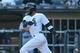 Aug 30, 2015; Chicago, IL, USA; Chicago White Sox shortstop Alexei Ramirez (10) hits a single during the eleventh inning against the Seattle Mariners at U.S Cellular Field. The White Sox won 6-5 in 11 innings. Mandatory Credit: Dennis Wierzbicki-USA TODAY Sports