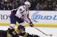 Boston Bruins' Adam McQuaid (54) defends against Washington Capitals' Marcus Johansson (90) during the first period of an NHL hockey game in Boston, Tuesday, Jan. 5, 2016. (AP Photo/Michael Dwyer)