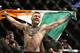 Conor McGregor reacts after defeating Jose Aldo during a featherweight championship mixed martial arts bout at UFC 194, Saturday, Dec. 12, 2015, in Las Vegas. (AP Photo/John Locher)