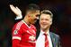 MANCHESTER, ENGLAND - SEPTEMBER 30: Louis van Gaal manager of Manchester United celebrates victory with winning goalscorer Chris Smalling in the UEFA Champions League Group B match between Manchester United FC and VfL Wolfsburg at Old Trafford on September 30, 2015 in Manchester, United Kingdom. (Photo by Dean Mouhtaropoulos/Getty Images)