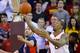 Arizona forward Mark Tollefsen, left, and Southern California forward Darion Clark (0) fight for the ball during the first half of an NCAA college basketball game, Saturday, Jan. 9, 2016, in Los Angeles. (AP Photo/Gus Ruelas)