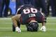 Houston Texans defensive end J.J. Watt (99) holds his head to the turf after he was injured during the second half of an NFL wild-card playoff football game against the Kansas City Chiefs, Saturday, Jan. 9, 2016, in Houston. (AP Photo/Tony Gutierrez)