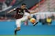 AC Milan's Carlos Bacca controls the ball a Serie A soccer match between AC Milan and Bologna, at the San Siro stadium in Milan, Italy, Wednesday Jan. 6, 2016. (AP Photo/Luca Bruno)