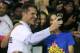 Michigan football coach Jim Harbaugh takes a selfie with first lady Michelle Obama, center, and Grammy award winner Ciara during the citywide College Signing Day, Friday, May 1, 2015, at Wayne State University in Detroit. The first lady talked to a rally of more than 2,000 Detroit high school students about the importance of committing to education beyond high school as part of her