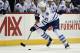 Toronto Maple Leafs left wing James van Riemsdyk (21) drives the puck down ice during the first period of an NHL hockey game against the New York Islanders on Sunday, Dec. 27, 2015, in New York. (AP Photo/Kathy Kmonicek)