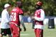 Washington Redskins cornerback DeAngelo Hall, right, talks with teammate Junior Galette during the teams NFL football training camp in Richmond, Va., Saturday, Aug. 1, 2015. (AP Photo/Jason Hirschfeld)