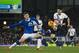 Everton's John Stones, left, fights for the ball against Tottenham's Son Heung-Min during the English Premier League soccer match between Everton and Tottenham at Goodison Park Stadium, Liverpool, England, Sunday Jan. 3, 2016. (AP Photo/Jon Super)