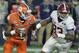 Clemson quarterback Deshaun Watson, left, tries to get away from Alabama's Jonathan Allen during the first half of the NCAA college football playoff championship game Monday, Jan. 11, 2016, in Glendale, Ariz. (AP Photo/Chris Carlson)