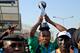 Nigeria's Kelechi Nwakali carries the Fifa Under-17 World Cup trophy on his head in the midst of a crowd gathered to receive the triumphant Nigeria U17 team, the Golden Eaglets, at Nnamdi Azikiwe Airport in Abuja, on November 11, 2015. Nigeria's Golden Eaglets emerged champions of the Fifa Under-17 World Cup in Chile after defeating Mali 2-0. AFP PHOTO / STRINGER (Photo credit should read -/AFP/Getty Images)