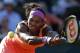 FILE - In this June 4, 2015, file photo, Serena Williams, of the United States, returns a shot in her semifinal match of the French Open tennis tournament against Timea Bacsinszky, of Switzerland, at the Roland Garros stadium in Paris. Williams withdrew from her opening match at the Hopman Cup on Monday, Jan. 4, 2016 because of inflammation in her left knee, an early setback in her preparations for an Australian Open title defense. (AP Photo/Francois Mori, File)