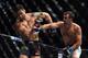 LAS VEGAS, NEVADA - DECEMBER 12: (R-L) Luke Rockhold punches Chris Weidman in their middleweight championship bout during the UFC 194 event inside MGM Grand Garden Arena on December 12, 2015 in Las Vegas, Nevada. (Photo by Jeff Bottari/Zuffa LLC/Zuffa LLC via Getty Images)