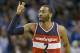 Washington Wizards' John Wall (2) waves there fingers after sinking a 3-point shot against the Orlando Magic during the second half of an NBA basketball game, Saturday, Jan. 9, 2016, in Orlando, Fla. Washington won 105-99. (AP Photo/John Raoux)