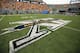 FILE - In this Sept. 1, 2012, file photo, the Big 12 Conference logo is painted on Mountaineer Field for an NCAA college football game between West Virginia and Marshall in Morgantown, W.Va. The Big 12 announced a new 13-year deal with ESPN and Fox Sports on Friday, Sept. 7, 2012, that is reportedly worth $2.6 billion and should provide long-term stability for a conference that once seemed on the brink of collapse. (AP Photo/Christopher Jackson, File)