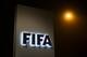 A sign of the FIFA is seen at the entrance of its headquarters on December 3, 2015 in Zurich.
The multi-million dollar corruption scandal engulfing FIFA widened on December 3, with 16 people indicted by US justice officials who pledged an unremitting crackdown on an 'outrageous' betrayal of trust. / AFP / FABRICE COFFRINI (Photo credit should read FABRICE COFFRINI/AFP/Getty Images)