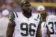 FILE - In this Saturday, Aug. 29, 2015 file photo, New York Jets defensive end Muhammad Wilkerson (96) walks the sidelines during the second half of a preseason NFL football game against the New York Giants in East Rutherford, N.J. Muhammad Wilkerson was 10 when his mother had breast cancer. Wilkerson honored 96 _ the number of his jersey _ breast cancer survivors at a three-course luncheon Tuesday, Oct. 13, 2015 at Central Park restaurant not far from where he grew up. October is the NFL's Breast Cancer Awareness month. (AP Photo/Seth Wenig)