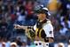 Pittsburgh Pirates catcher Chris Stewart gestures to the Mound during a baseball game against the San Francisco Giants, Saturday, Aug. 22, 2015, in Pittsburgh. (AP Photo/Fred Vuich)
