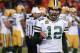 Green Bay Packers quarterback Aaron Rodgers pumps his fist as he walks off the field in the closing minutes of the team's NFL wild-card playoff football game against the Washington Redskins in Landover, Md., Sunday, Jan. 10, 2016. The Packers won 35-18. (AP Photo/Alex Brandon)