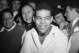 Champion Joe Louis transforms his usual dead-pan expression into a broad grin in his dressinjg room after his championship fight with Lou Nova at the Polo Grounds in New York, Sept.29, 1941. Louis won fight with Nova with a knock out in the sixth round. (AP Photo)