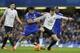 Chelsea's Diego Costa, left, competes for the ball with Everton's John Stones during the English Premier League soccer match between Chelsea and Everton at Stamford Bridge stadium in London, Saturday, Jan. 16, 2016. (AP Photo/Matt Dunham)
