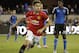 Manchester United midfielder Andreas Pereira, left, reacts after scoring a goal as San Jose Earthquakes midfielder Fatai Alashe, right, watches during the second half of an International Champions Cup soccer match Tuesday, July 21, 2015, in San Jose, Calif. Manchester United won 3-1. (AP Photo/Eric Risberg)