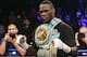 Deontay Wilder poses for photographs after of a WBC heavyweight title boxing match Artur Szpilka, of Poland, Saturday, Jan. 16, 2016, in New York. Wilder stopped Szpilka in the ninth round. (AP Photo/Frank Franklin II)