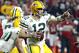 Green Bay Packers quarterback Aaron Rodgers (12) points to a receiver during the second half of an NFL divisional playoff football game against the Arizona Cardinals, Saturday, Jan. 16, 2016, in Glendale, Ariz. (AP Photo/Ross D. Franklin)