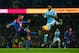 MANCHESTER, ENGLAND - JANUARY 16: James McArthur of Crystal Palace clears the ball under pressure from Fabian Delph of Manchester City during the Barclays Premier League match between Manchester City and Crystal Palace at Etihad Stadium on January 16, 2016 in Manchester, England. (Photo by Shaun Botterill/Getty Images)