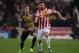 Arsenal's Spanish defender Nacho Monreal (L) vies with Stoke City's English-born Irish striker Jonathan Walters during the English Premier League football match between Stoke City and Arsenal at the Britannia Stadium in Stoke-on-Trent, central England on January 17, 2016. AFP PHOTO / OLI SCARFFRESTRICTED TO EDITORIAL USE. No use with unauthorized audio, video, data, fixture lists, club/league logos or 'live' services. Online in-match use limited to 75 images, no video emulation. No use in betting, games or single club/league/player publications.. / AFP / OLI SCARFF (Photo credit should read OLI SCARFF/AFP/Getty Images)