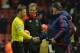 Manchester United's Welsh assistant manager Ryan Giggs (R obscured) shakes hands with referee Mark Clattenburg (L) as Manchester United's Dutch manager Louis van Gaal (R) and Liverpool's German manager Jurgen Klopp (2L) look on after the English Premier League football match between Liverpool and Manchester United at Anfield in Liverpool, northwest England, on January 17, 2016. Wayne Rooney scored the winning goal in Manchester United's 1-0 victory over Liverpool. AFP PHOTO / PAUL ELLIS
RESTRICTED TO EDITORIAL USE. No use with unauthorized audio, video, data, fixture lists, club/league logos or 'live' services. Online in-match use limited to 75 images, no video emulation. No use in betting, games or single club/league/player publications. / AFP / PAUL ELLIS (Photo credit should read PAUL ELLIS/AFP/Getty Images)
